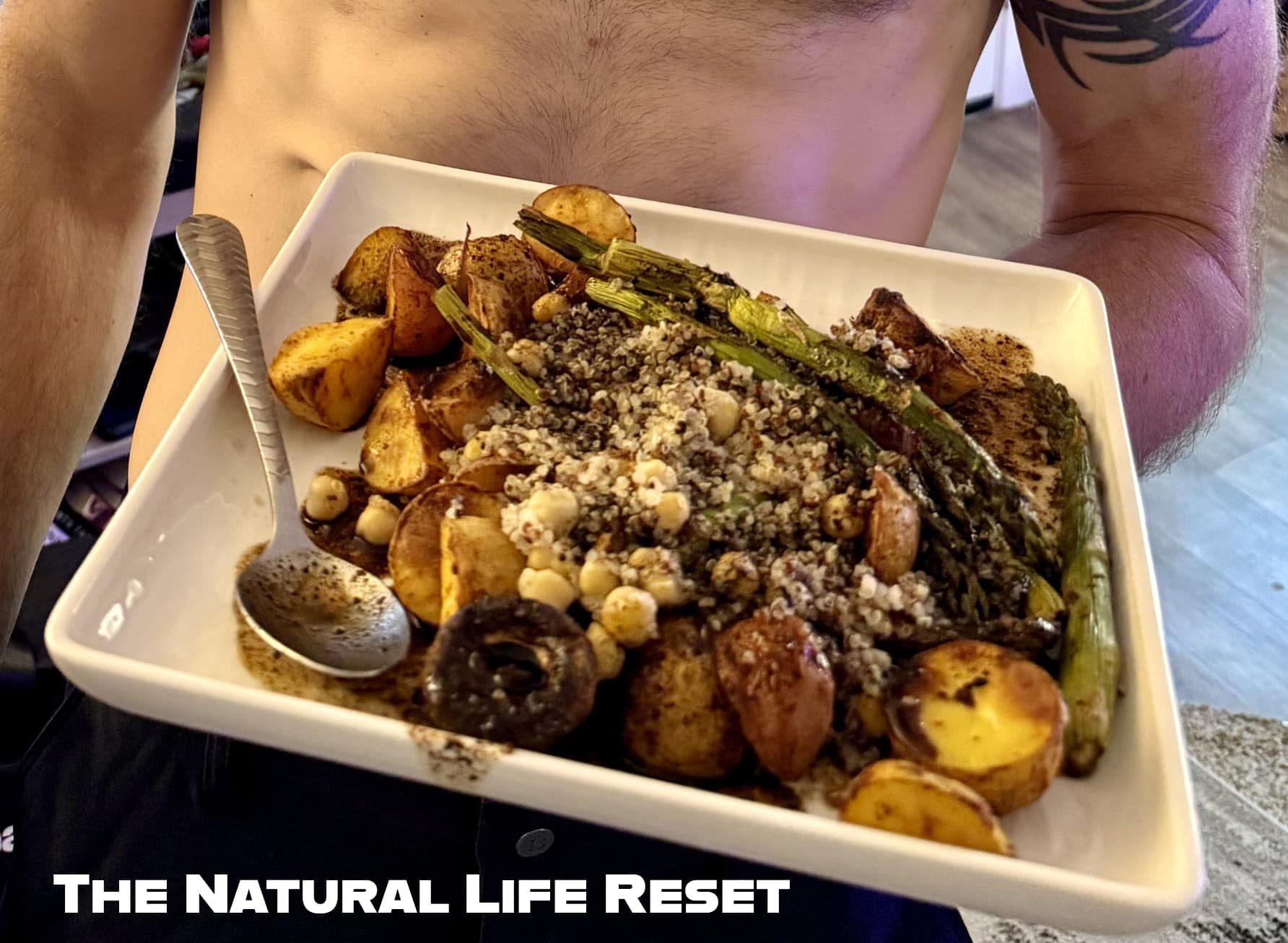 A whole food plant-based bowl featuring roasted potatoes, air-fried vegetables, quinoa, chickpeas, and a homemade balsamic date syrup reduction.